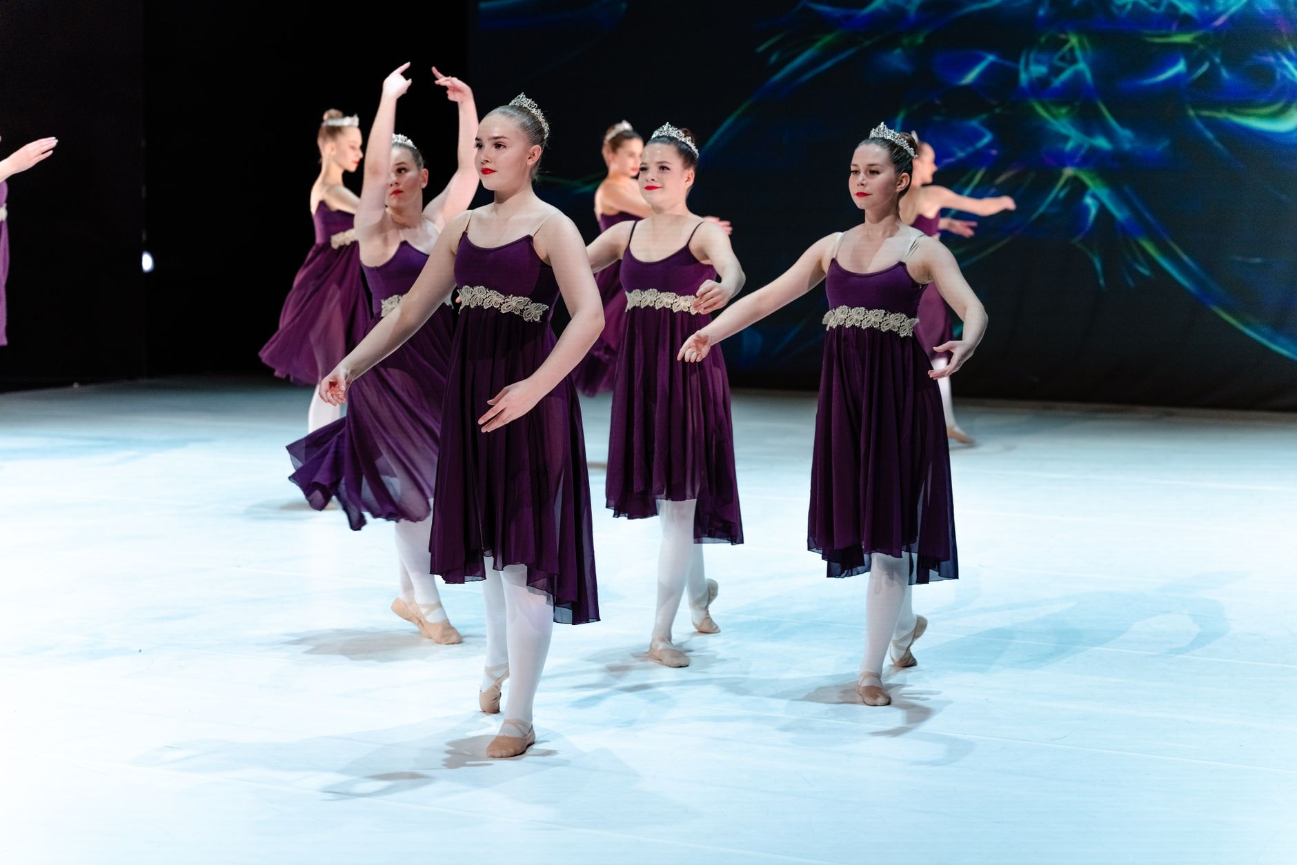 Dance ensemble performing on stage